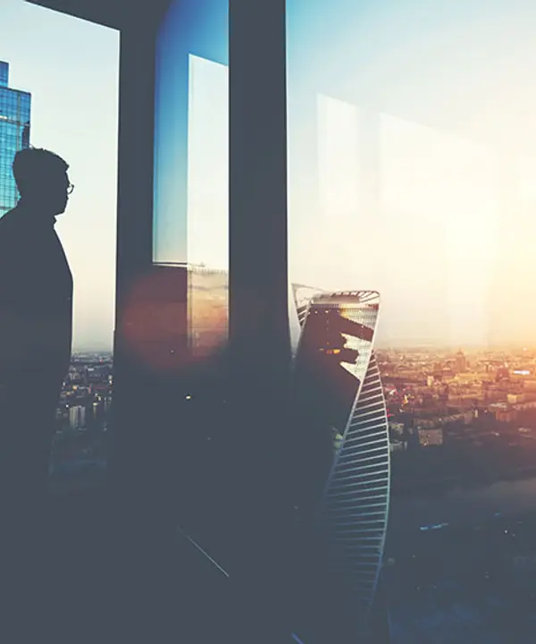 Professionals talking in front of the city skyline