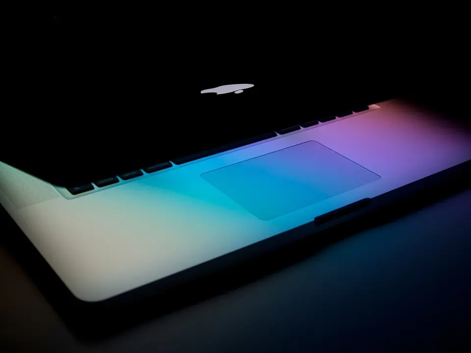 Glowing laptop in a dark setting