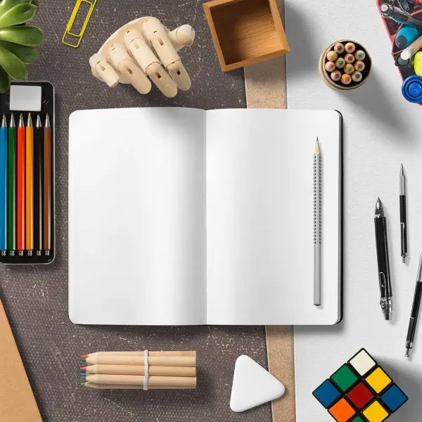 Open notebook with colored pencils